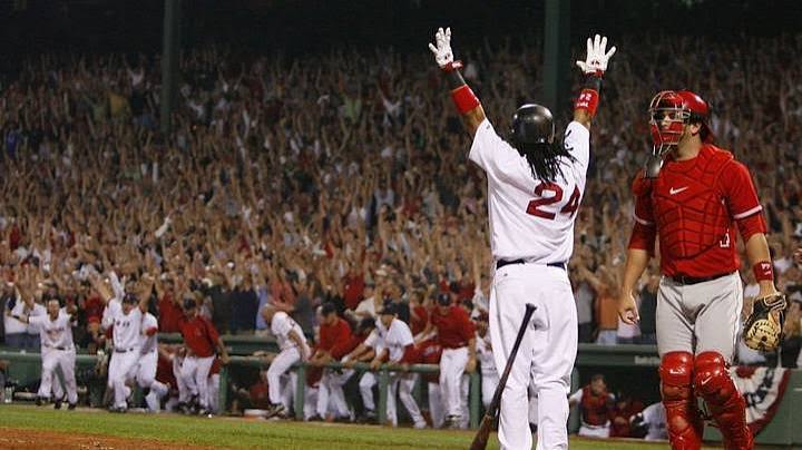 Manny Ramirez raising his arms as the crowd erupts after a walkout home run